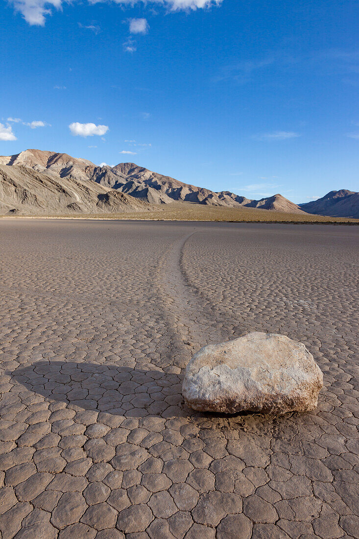 Sailing stone & track on the Racetrack Playa in Death Valley National Park in the Mojave Desert, California.