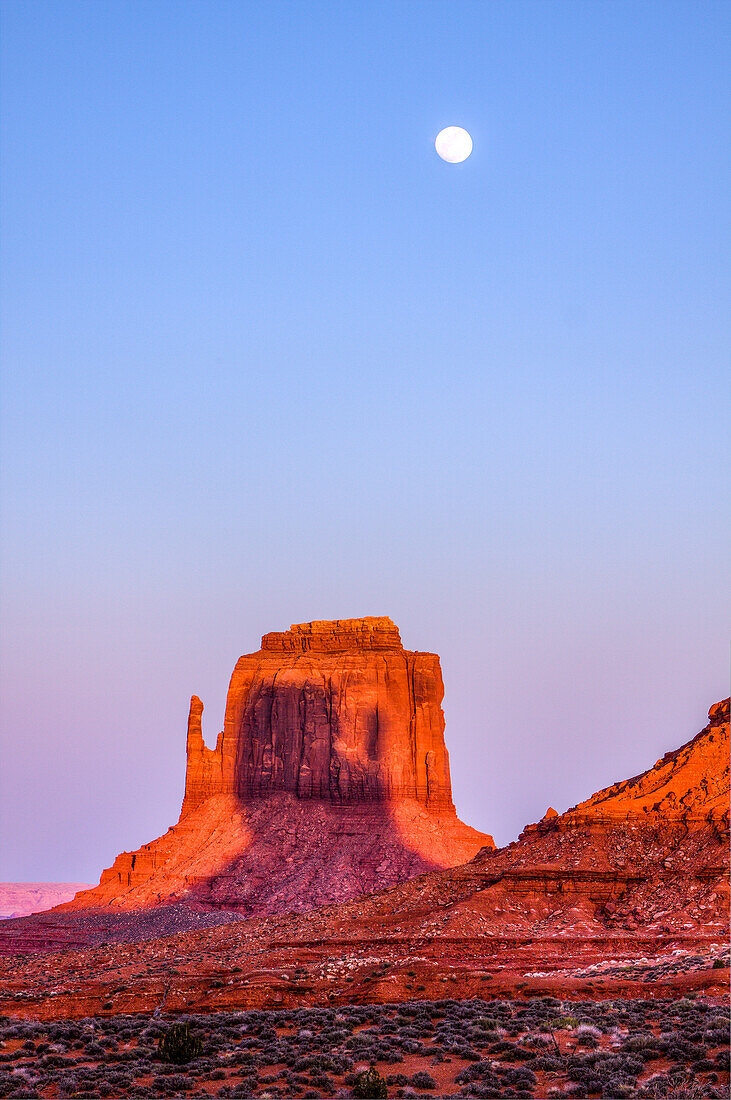 Shadow of the West Mitten projected onto the East Mitten at sunset in the Monument Valley Navajo Tribal Park in Arizona. This phenomenon occurs twice per year.