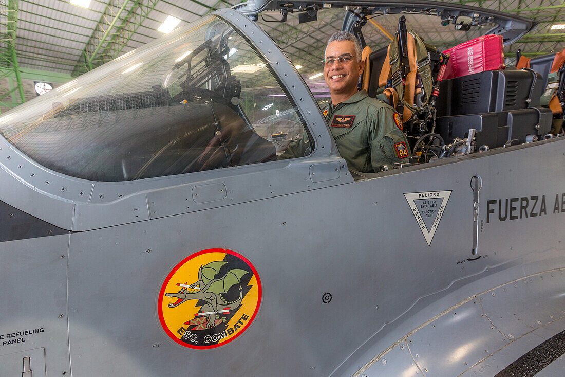 A Dominican Air Force pilot in the cockpit of a Super Tucano fighter aircraft at the San Isidro Air Base in the Dominican Republic.