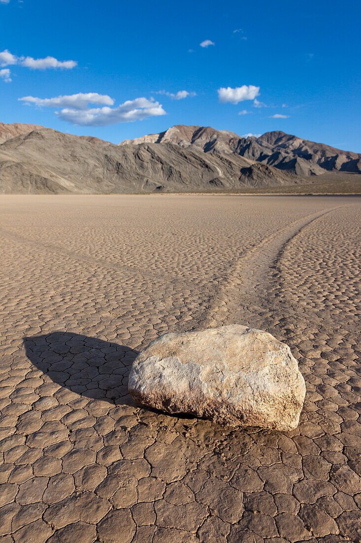 Sailing stone & track on the Racetrack Playa in Death Valley National Park in the Mojave Desert, California.