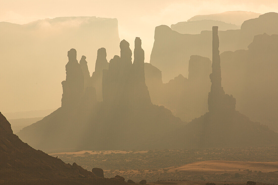 Telephoto view of the Totem Pole & the Yei Bi Chei in the Monument Valley Navajo Tribal Park in Arizona.