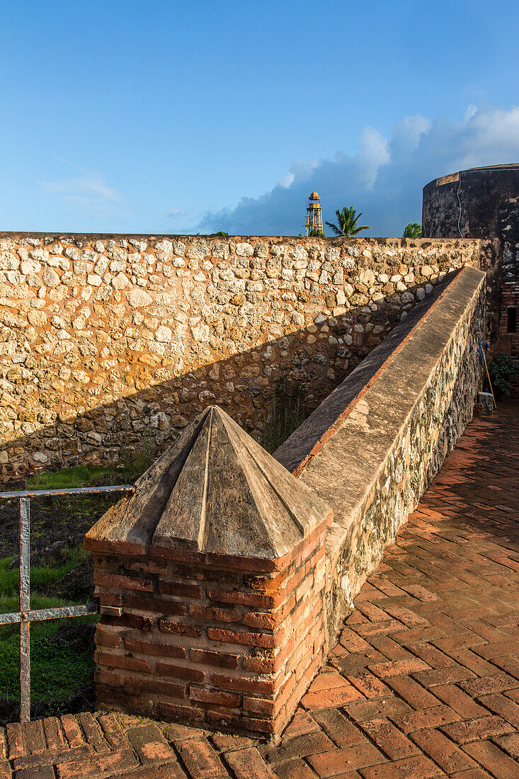 Architectural detail of Fortaleza San Felipe, now a museum at Puerto Plata, Dominican Republic. In the background ins the cast iron lighthouse from 1879.