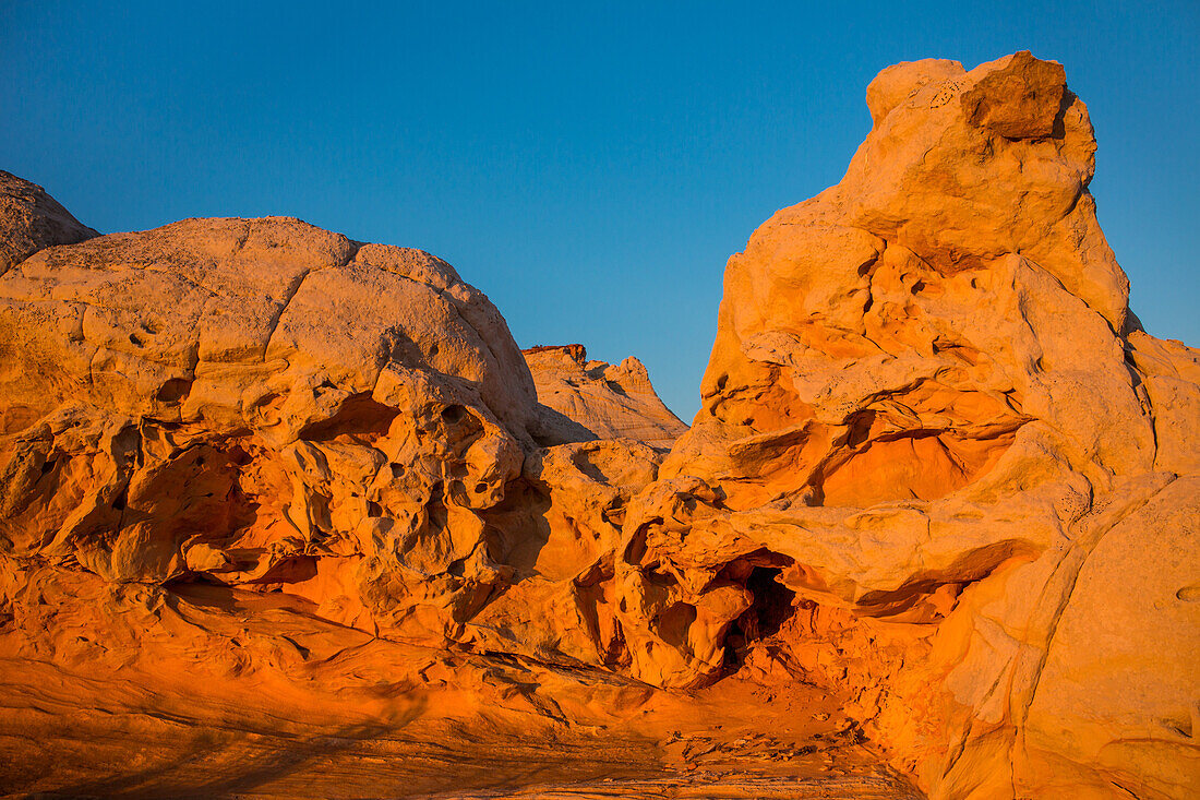 Colorful eroded Navajo sandstone at sunset in the White Pocket Recreation Area, Vermilion Cliffs National Monument, Arizona.