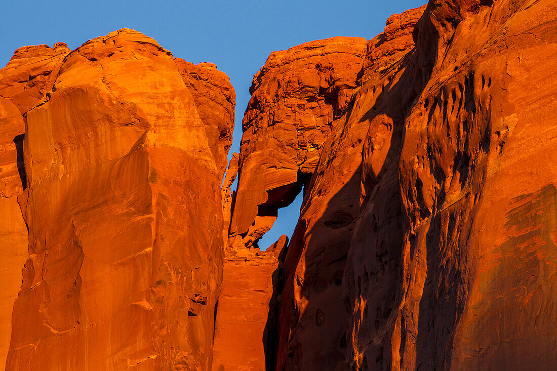 A small sandstone arch on Elephant Butte in the Monument Valley Navajo Tribal Park in Arizona.