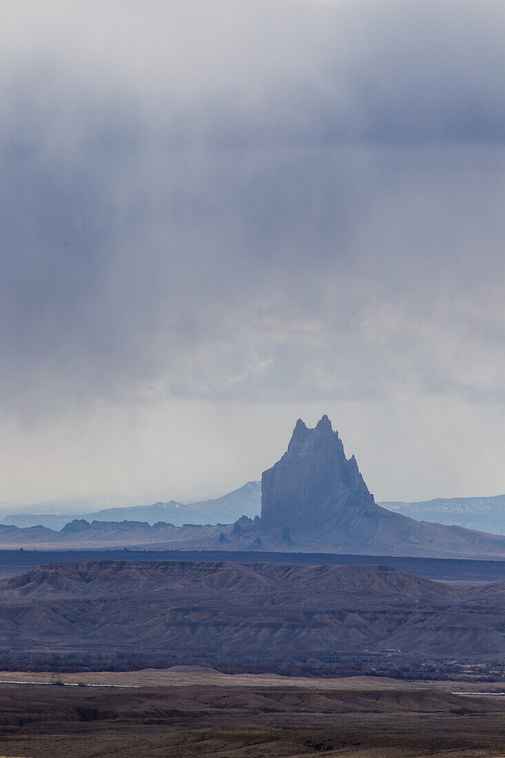 Shiprock is a volcanic basalt monolith on the Navajo Reservation near the town of Shiprock, New Mexico. Virga is the name for these streaks of rain that evaporate before reaching the desert floor.