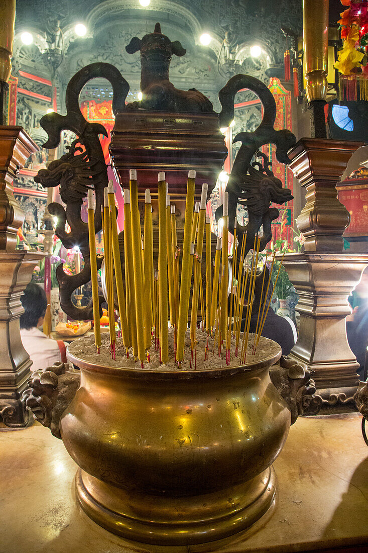 Large joss sticks or incense burning in the Buddhist Man Mo Temple in Hong Kong, China.