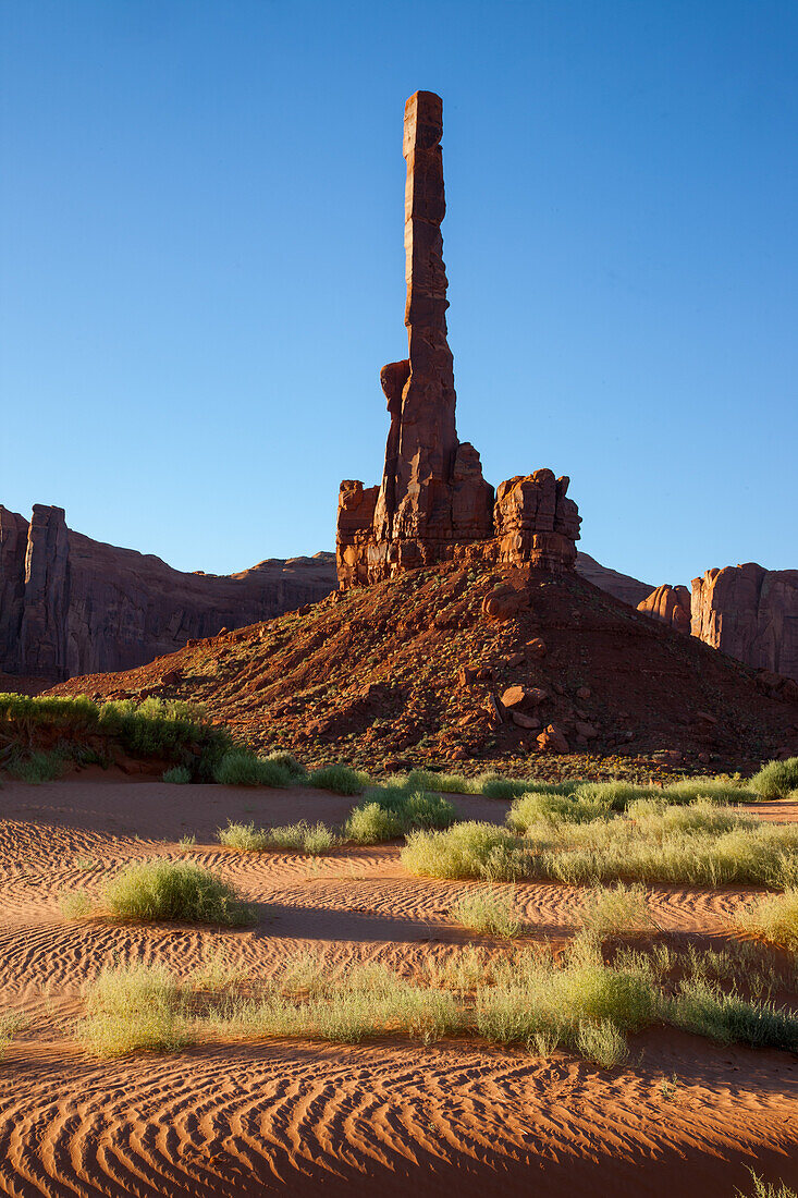 The Totem Pole with rippled sand in the Monument Valley Navajo Tribal Park in Arizona.