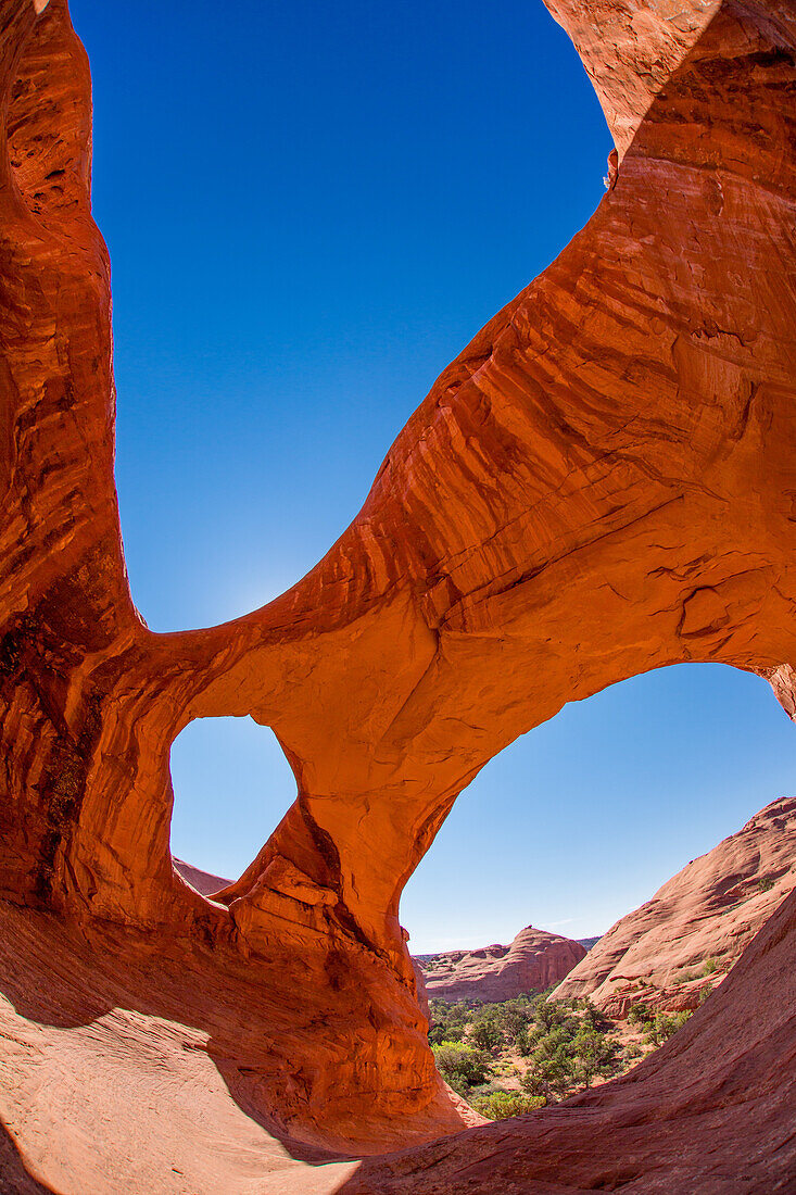 Spiderweb Arch, a large natural double arch in the Monument Valley Navajo Tribal Park in Arizona.