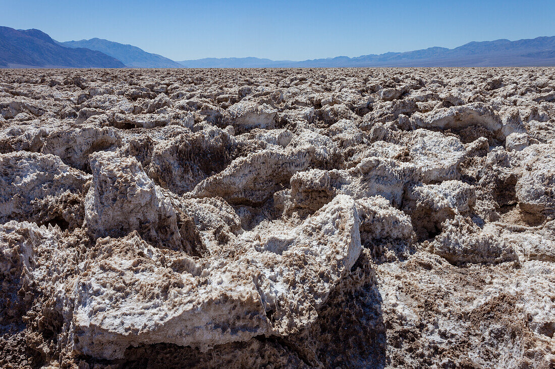 Jagged blocks of halite crystals in the Devil's Golf Course in the Mojave Desert in Death Valley National Park, California.