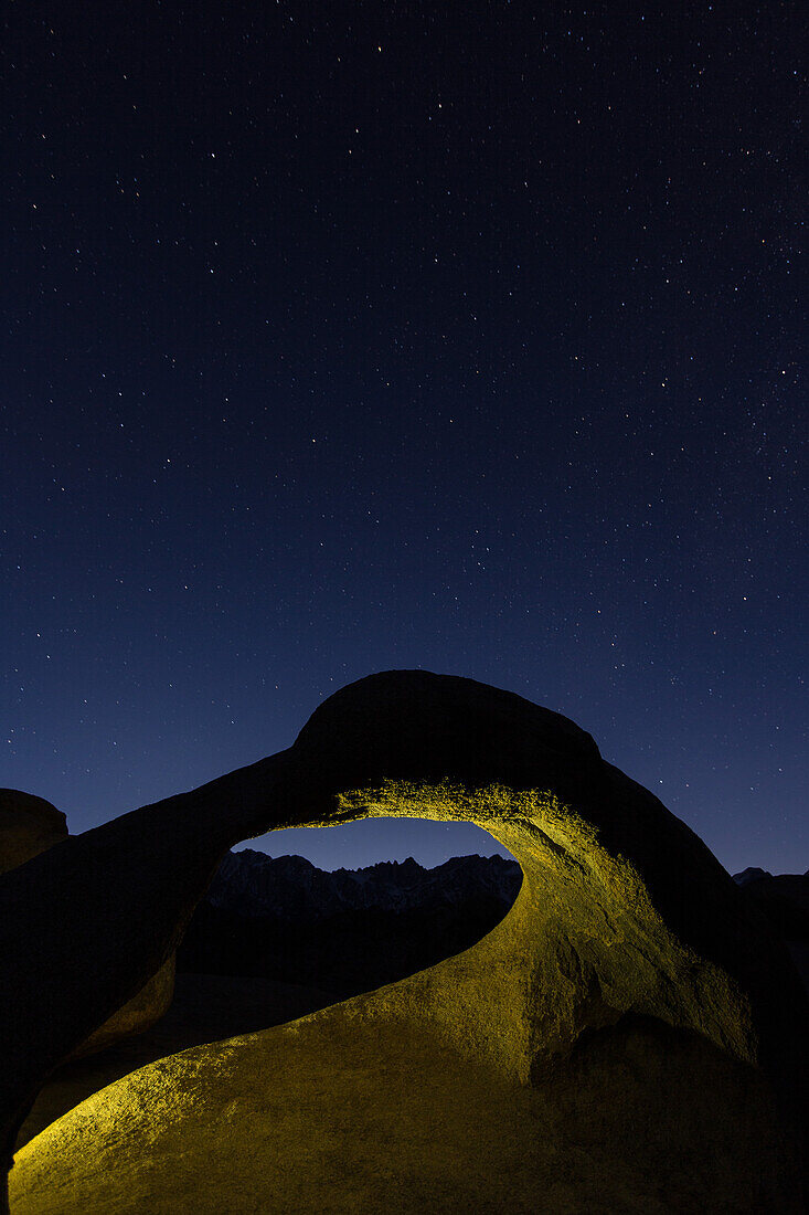 Stars over Mobius Arch in the Alabama Hills near Lone Pine, California, with the silhouette of Mt. Whitney under the arch.