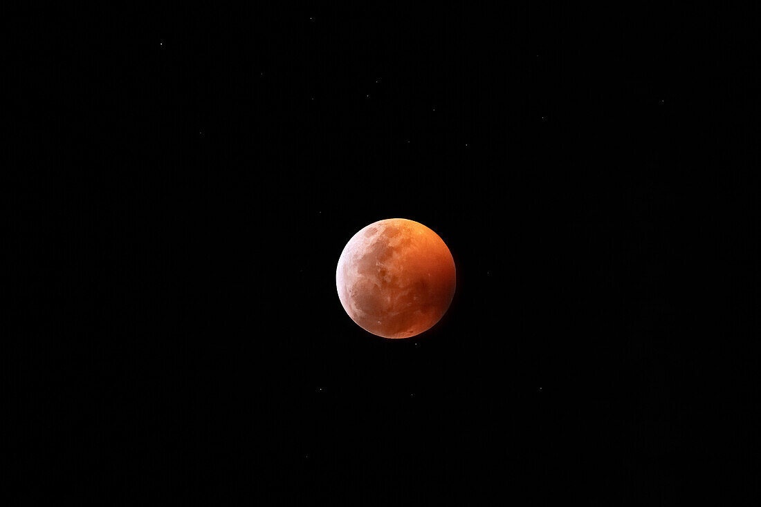 Lunar eclipse of a super blood wolf moon at totaliity, 21 January 2019, viewed from Uxmal, Yucatan, Mexico.
