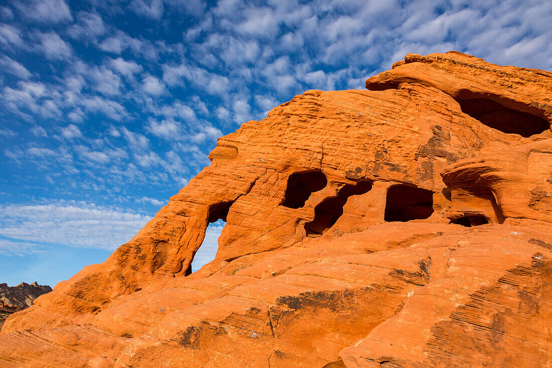 An unnamed natural arch in the eroded Aztec sandstone of Valley of Fire State Park in Nevada.