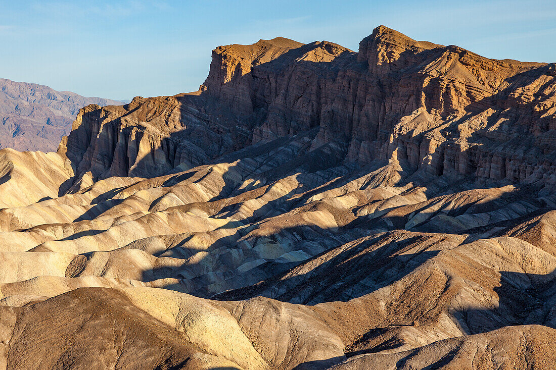 Eroded badlands of the Furnace Creek Formation & the Red Cathedral at Zabriskie Point in Death Valley National Park in California.