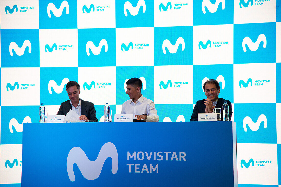 Alfonso Gomez the CEO of Telefonica Hispam (L), cyclist Nairo Quintana (C) and Fabian Hernandez CEO of Movistar Colombia (R), speak during a press conference announcing it's return to the Movistar Cycling team, in Bogota, Colombia on october 30, 2023.