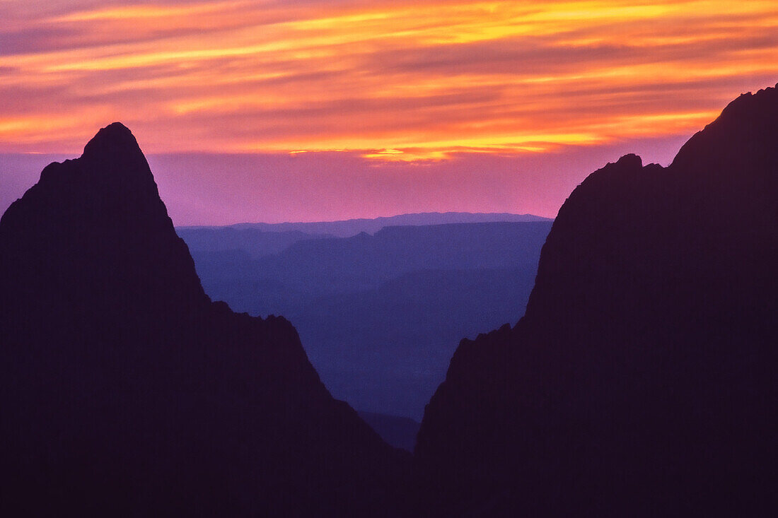 A colorful sunset at the Window in the Chisos Mountains in Big Bend National Park in Texas.