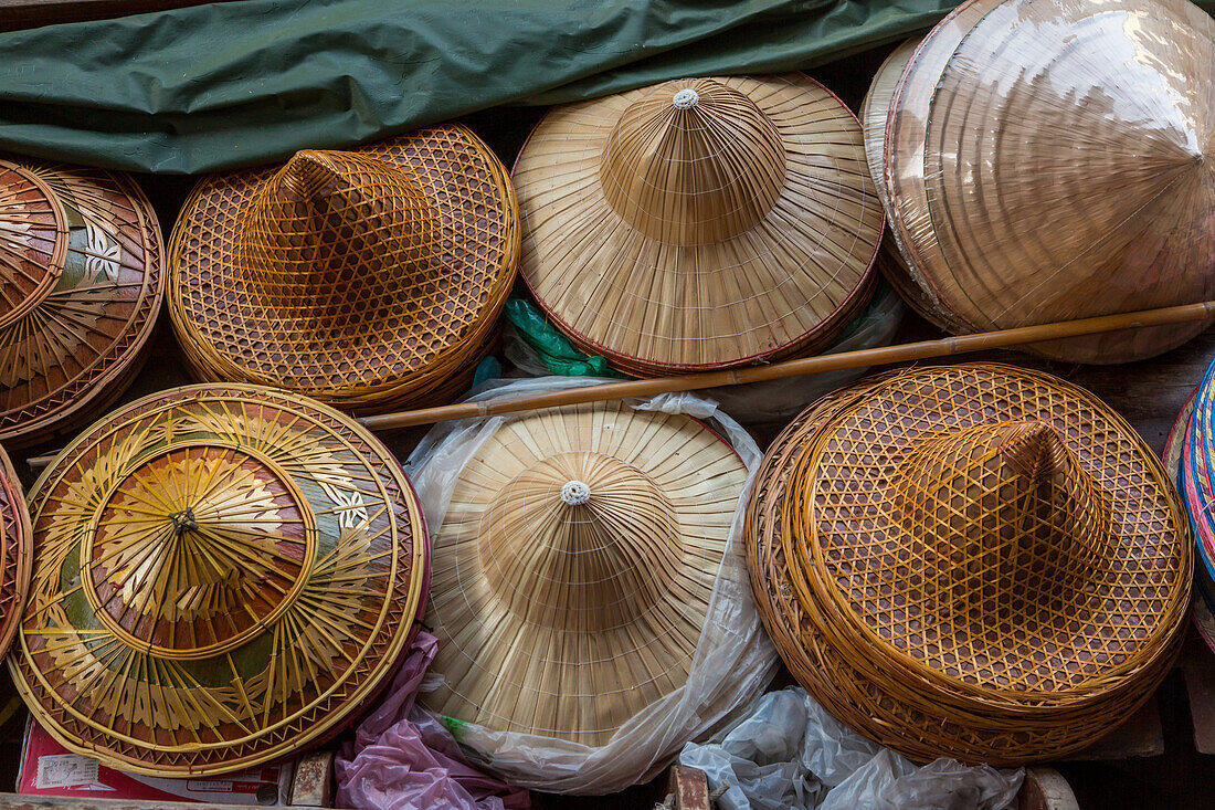 Traditional Thai hats for sale in the Damnoen Saduak Floating Market in Thailand.