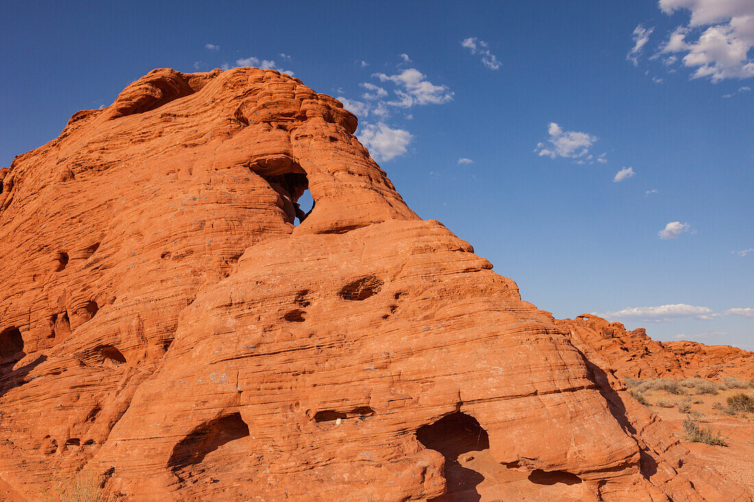 Two unnamed natural arches in the eroded Aztec sandstone of Valley of Fire State Park in Nevada.