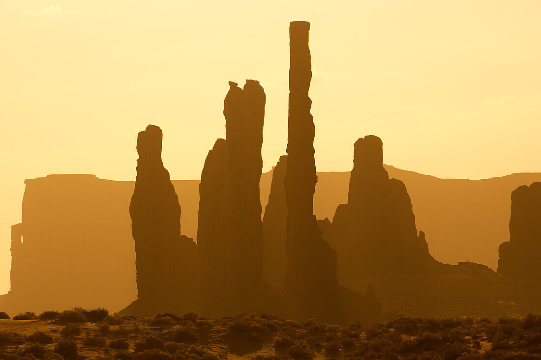 Telephoto view of the Totem Pole & the Yei Bi Chei in the Monument Valley Navajo Tribal Park in Arizona.