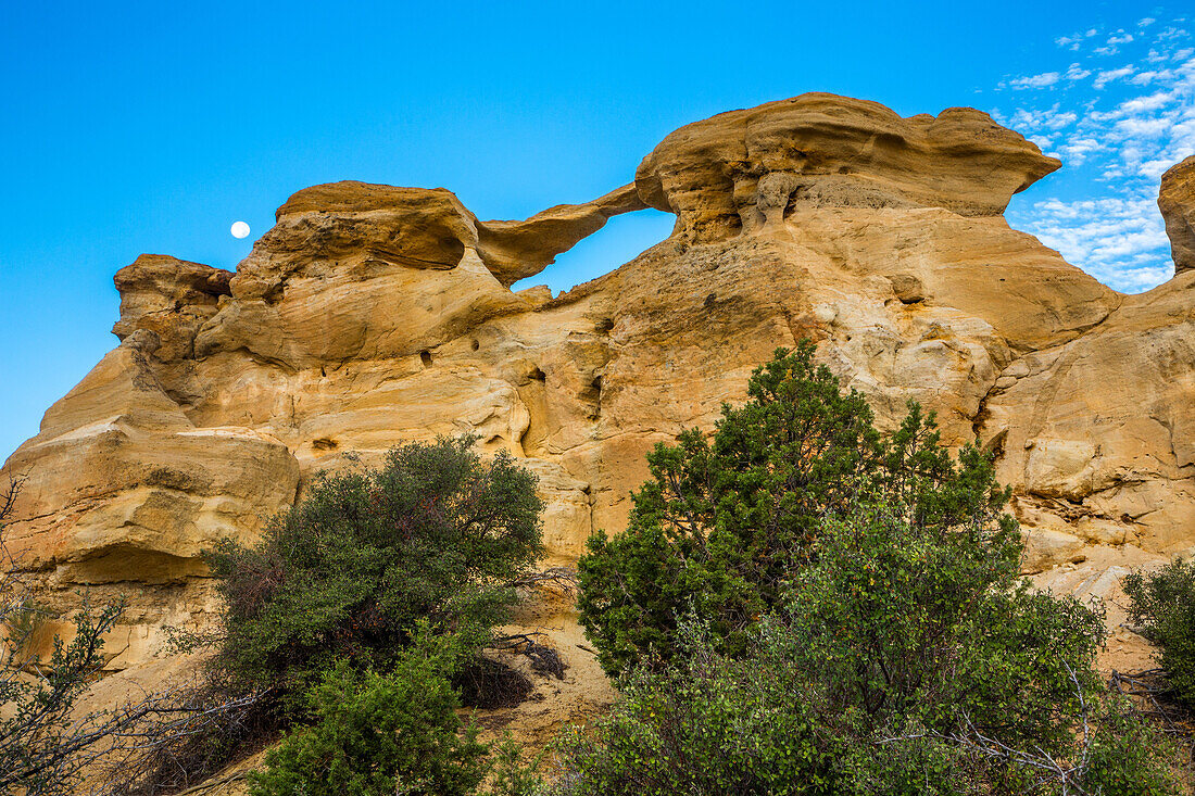 Moon and Graceful Arch in a remote desert area near Aztec in northwest New Mexico.