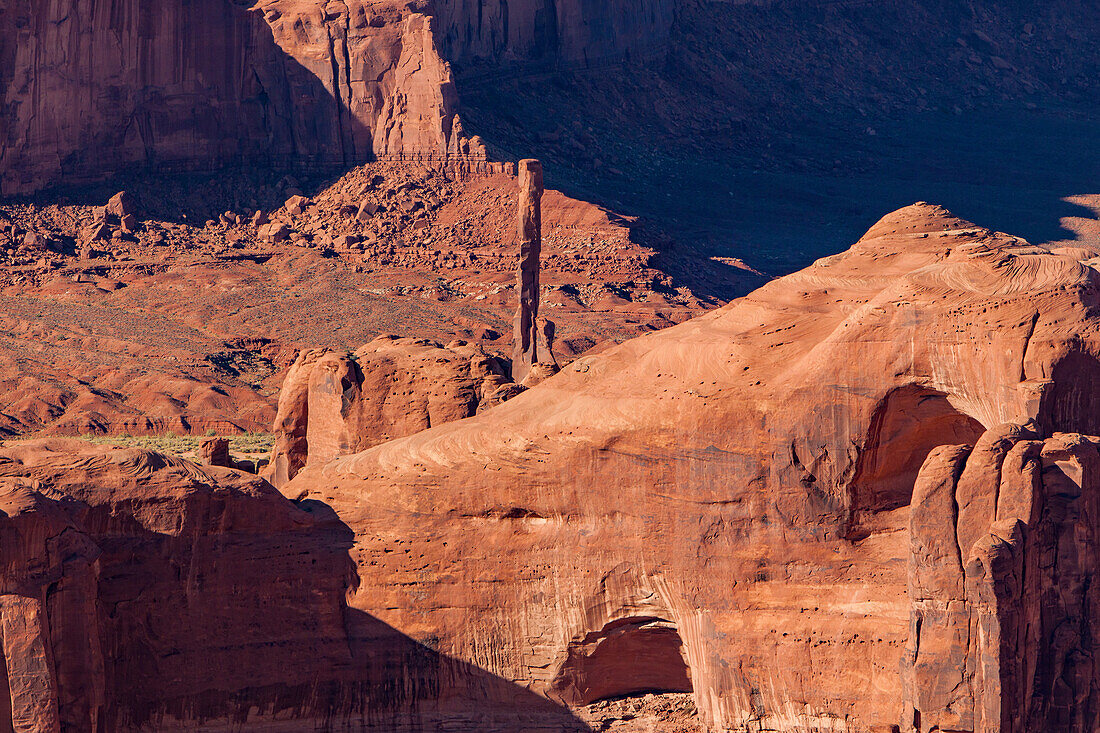 Telephoto view of the Totem Pole in Monument Valley from Hunt's Mesa in the Monument Valley Navajo Tribal Park in Arizona.