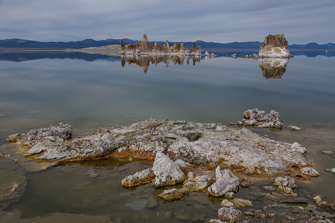 Tufa rock formations reflected in Mono Lake in California.