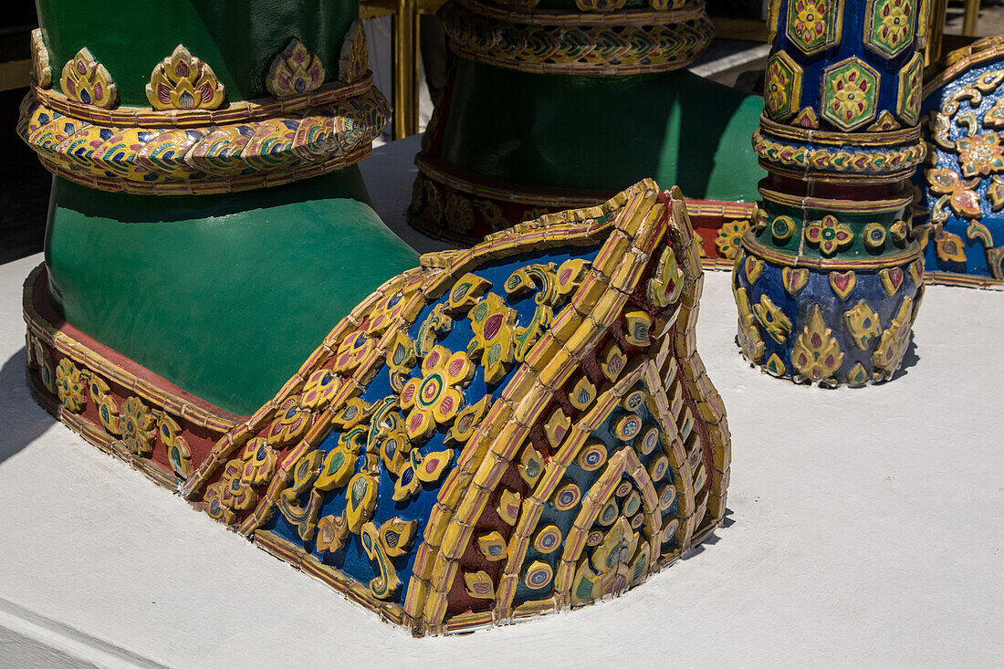 Foot of a Thotsakan, a yaksha guardian statue at the Temple of the Emerald Buddha complex at the Grand Palace in Bangkok, Thailand. A yaksha or yak is a giant guardian spirit in Thai lore.