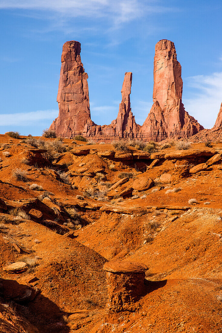 The Three Sisters, sandstone monoliths at the edge of Mitchell Mesa in the Monument Valley Navajo Tribal Park in Arizona.