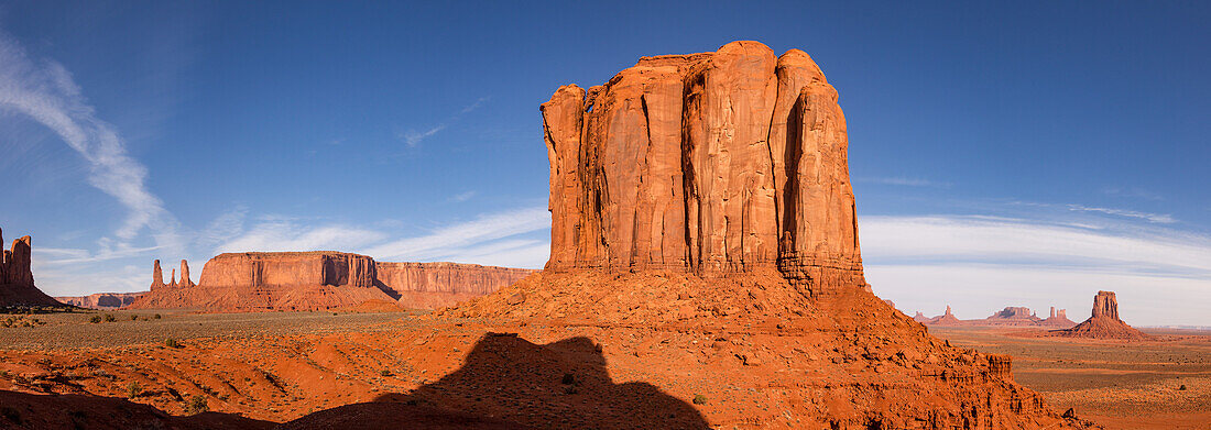 Sunrise view of the Merrick Butte & the monuments in the Monument Valley Navajo Tribal Park in Arizona. L-R: Three Sisters, Mitchell Mesa, Merrick Butte (foreground), Setting Hen, Big Indian Chief, Brigham's Tomb, King on the Throne, Castle Butte, Bear and Rabbit, Stagecoach, East Mitten Butte.