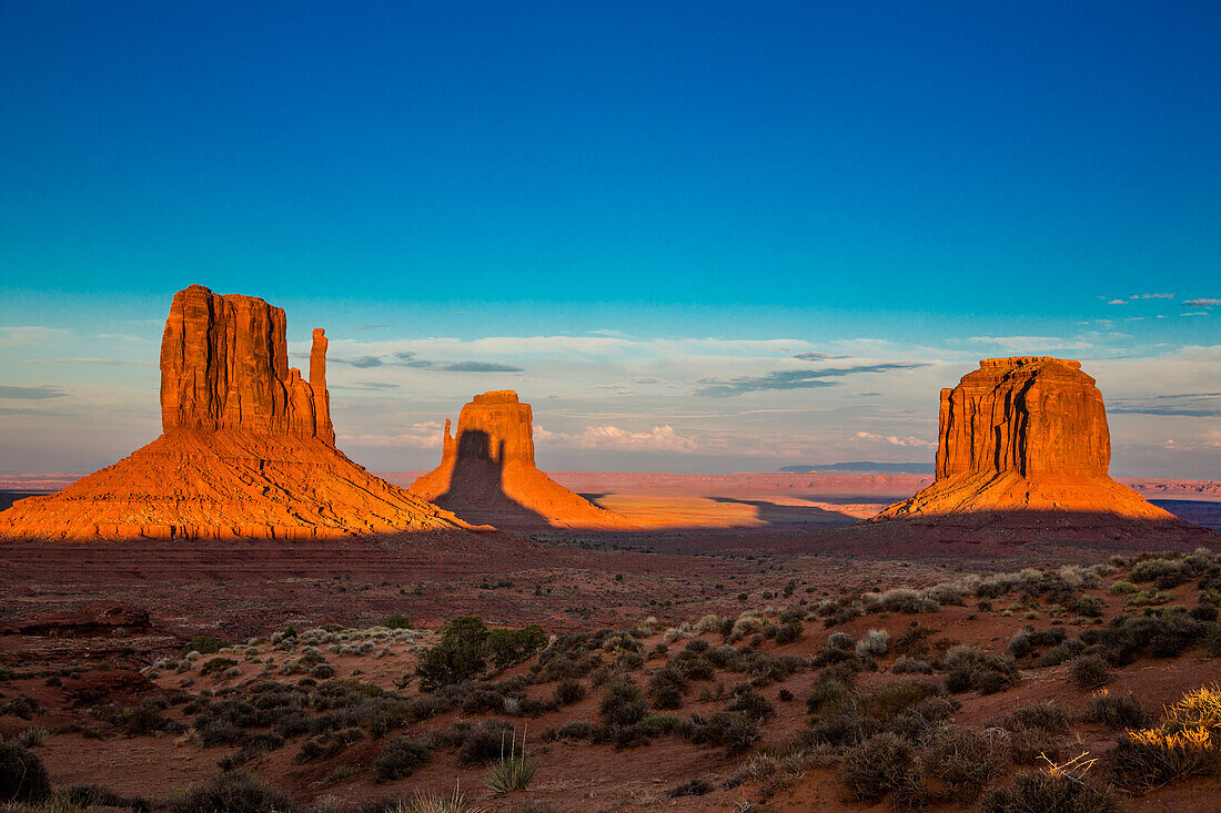 Shadow of the West Mitten projected onto the East Mitten at sunset in the Monument Valley Navajo Tribal Park in Arizona. This phenomenon occurs twice per year.