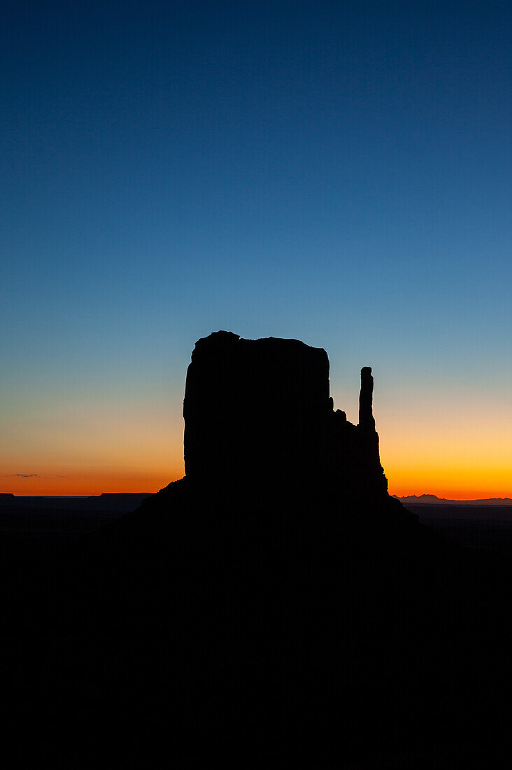 Predawn sky over the West Mitten before sunrise in the Monument Valley Navajo Tribal Park in Arizona.
