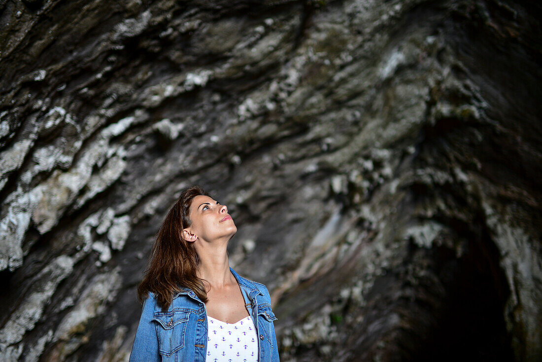 Young woman in Caves of Artà (Coves d’Artà) in the municipality of Capdepera, in the Northeast of the island of Mallorca, Spain