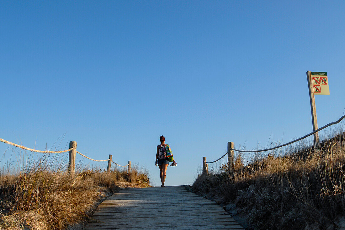 Young woman walking in Levante Beach - Platja de Llevant -, Formentera