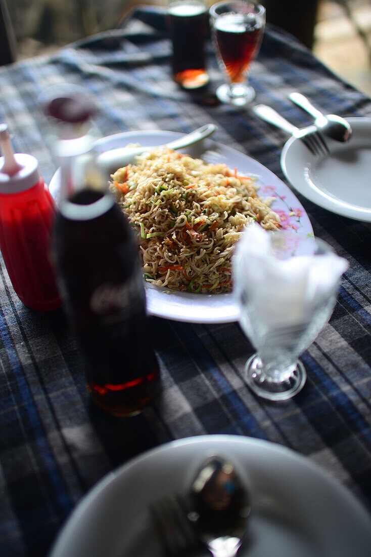 Noodles and sodas on restaurant table, Ahangama, Sri Lanka