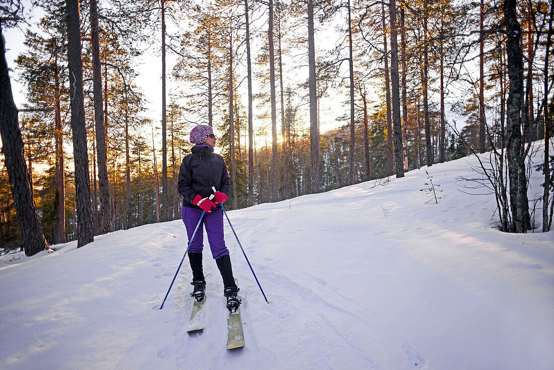 Young woman practicing Altai Skiing in Pyha ski resort, Lapland, Finland