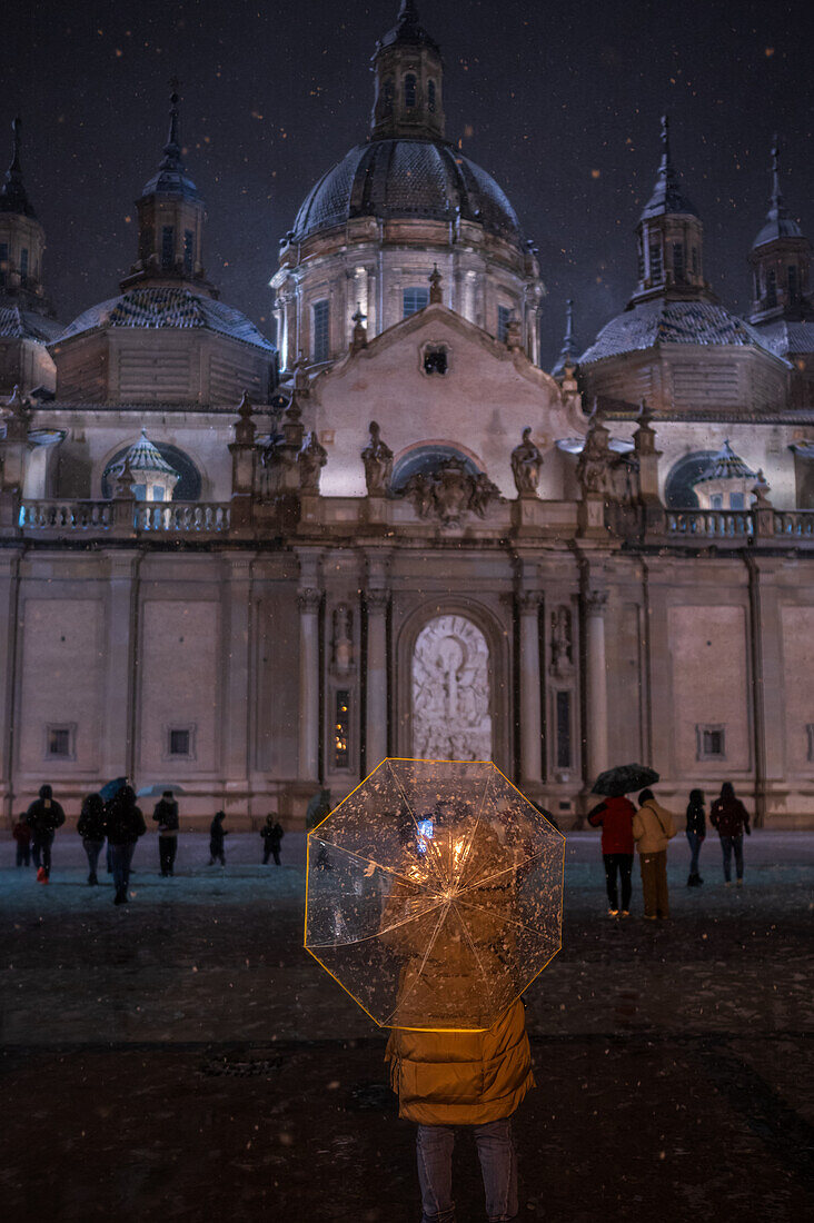 Snow falls over El Pilar Basilica during Storm Juan in Zaragoza, Spain