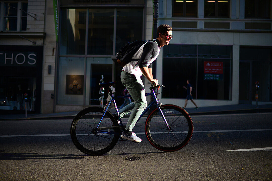 Bicycle rider in steep street of San Francisco.