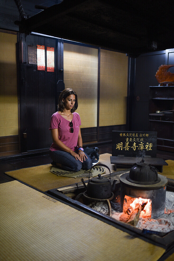 Young caucasian woman inside a traditional house.