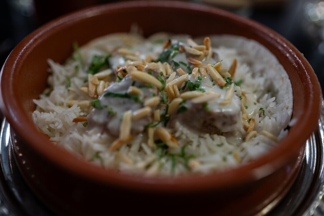 Mansaf, traditional Levantine dish made of lamb cooked in a sauce of fermented dried yogurt and served with rice or bulgur, Mosaico Restaurant, Zaragoza, Spain