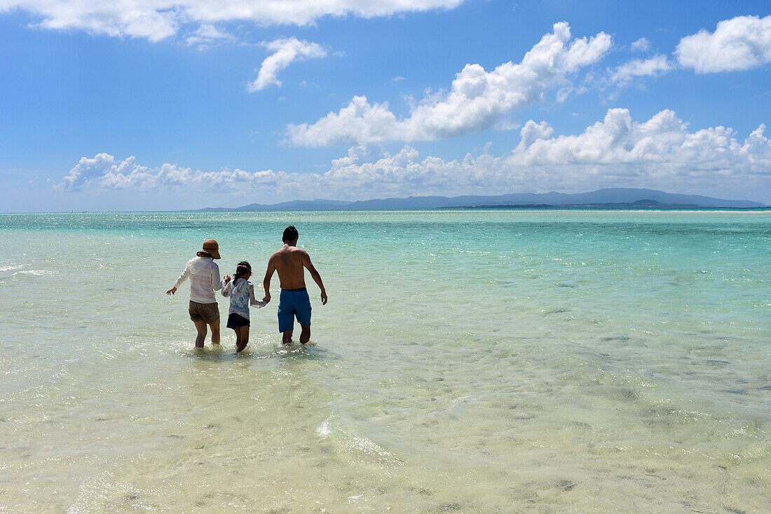 Family in Kondoi beach, Taketomi Island, Okinawa Prefecture, Japan