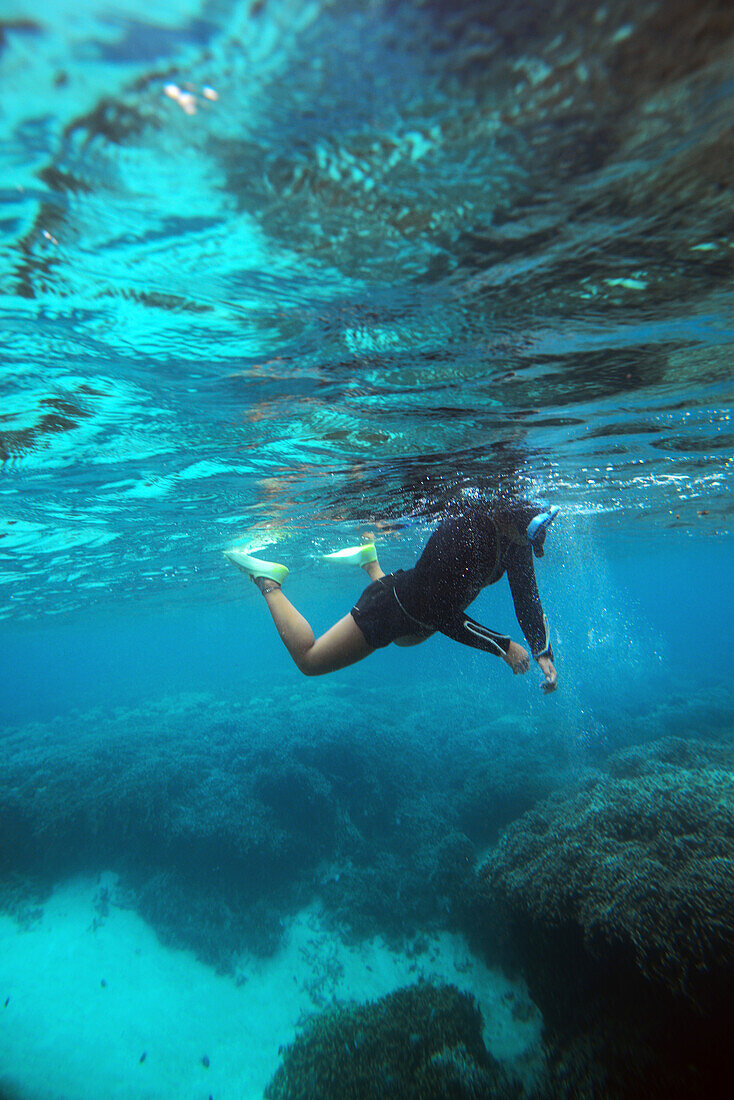 Young woman snorkeling in Ishigaki, Okinawa Prefecture, Japan