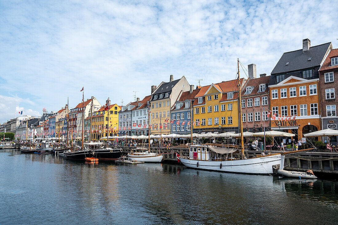 Colorfull facade and old ships along the Nyhavn Canal in Copenhagen Denmark