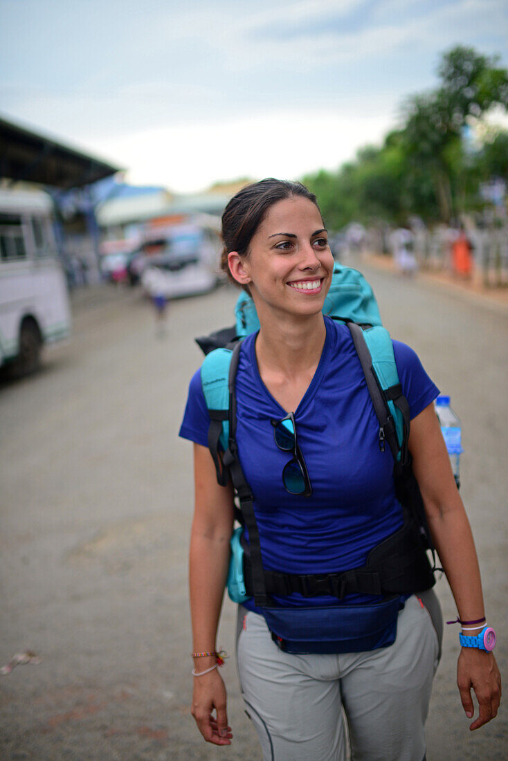 Young attractive female backpacker in Wellawaya bus station, Sri Lanka