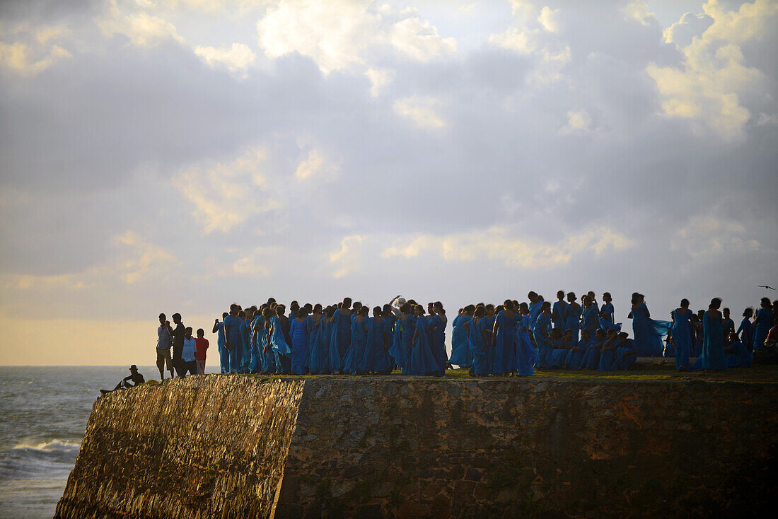 Numerous group of college students dressed in blue visit UNESCO World Heritage, Galle Fort, during Binara Full Moon Poya Day.