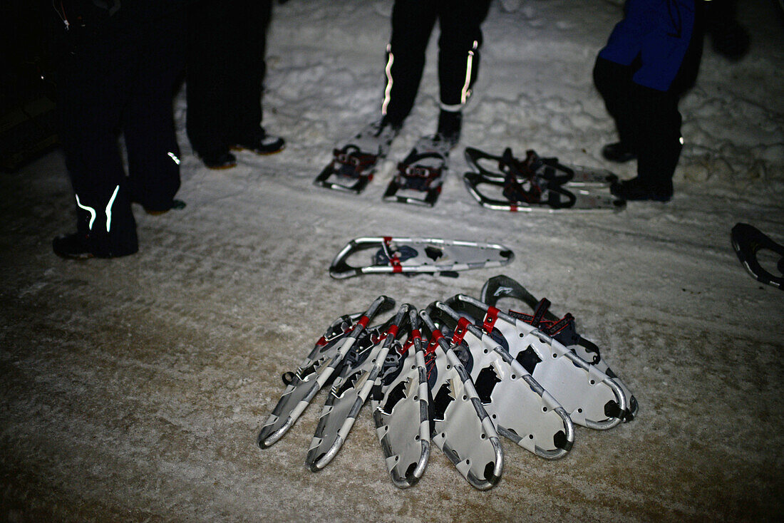 Snowshoeing at sunset through wilderness of Rovaniemi, with Safartica.