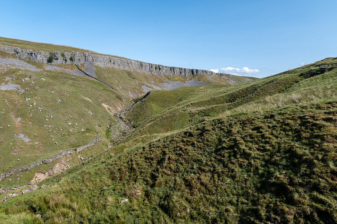 Daytime landscape of green field on a sunny day in Yorkshire Dales England