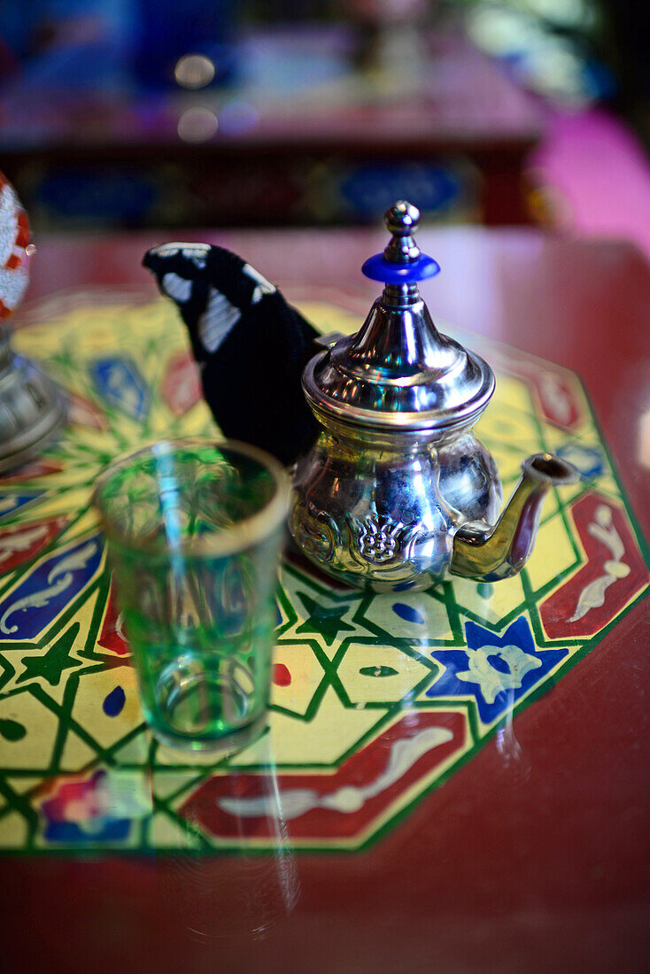 Tea glass and jar on table at tea house, Granada, Spain