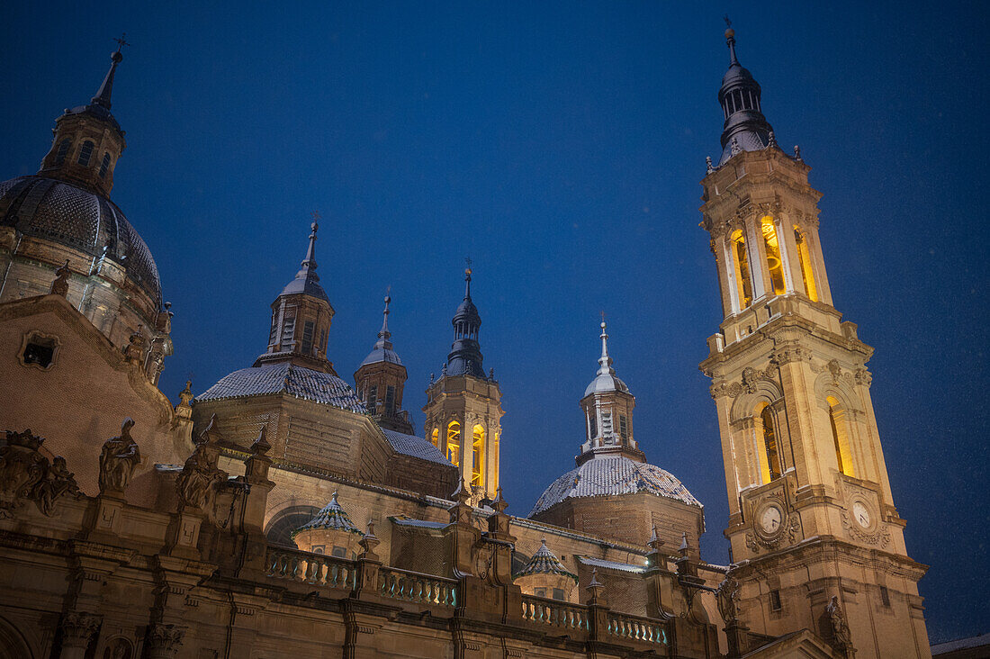 Snow falls over El Pilar Basilica during Storm Juan in Zaragoza, Spain