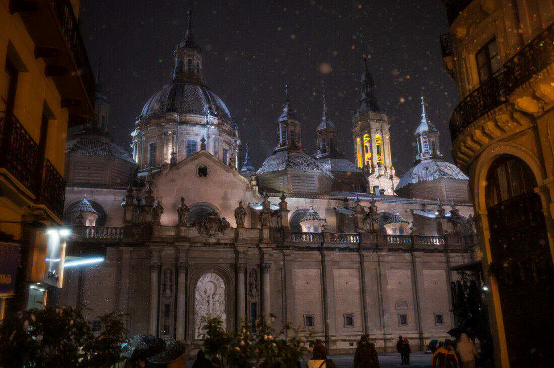 Snow falls over El Pilar Basilica during Storm Juan in Zaragoza, Spain