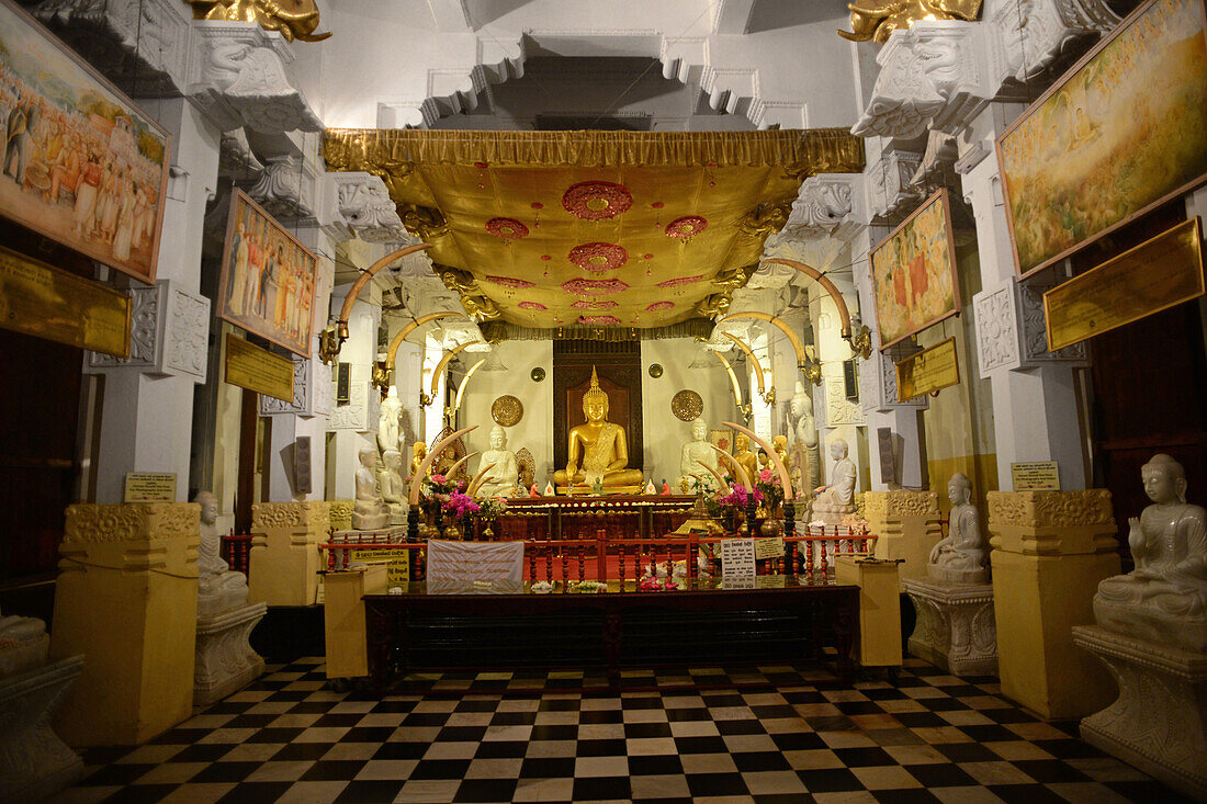 Golden Buddha statue inside the Temple of the Sacred Tooth Relic, Kandy, Sri Lanka,