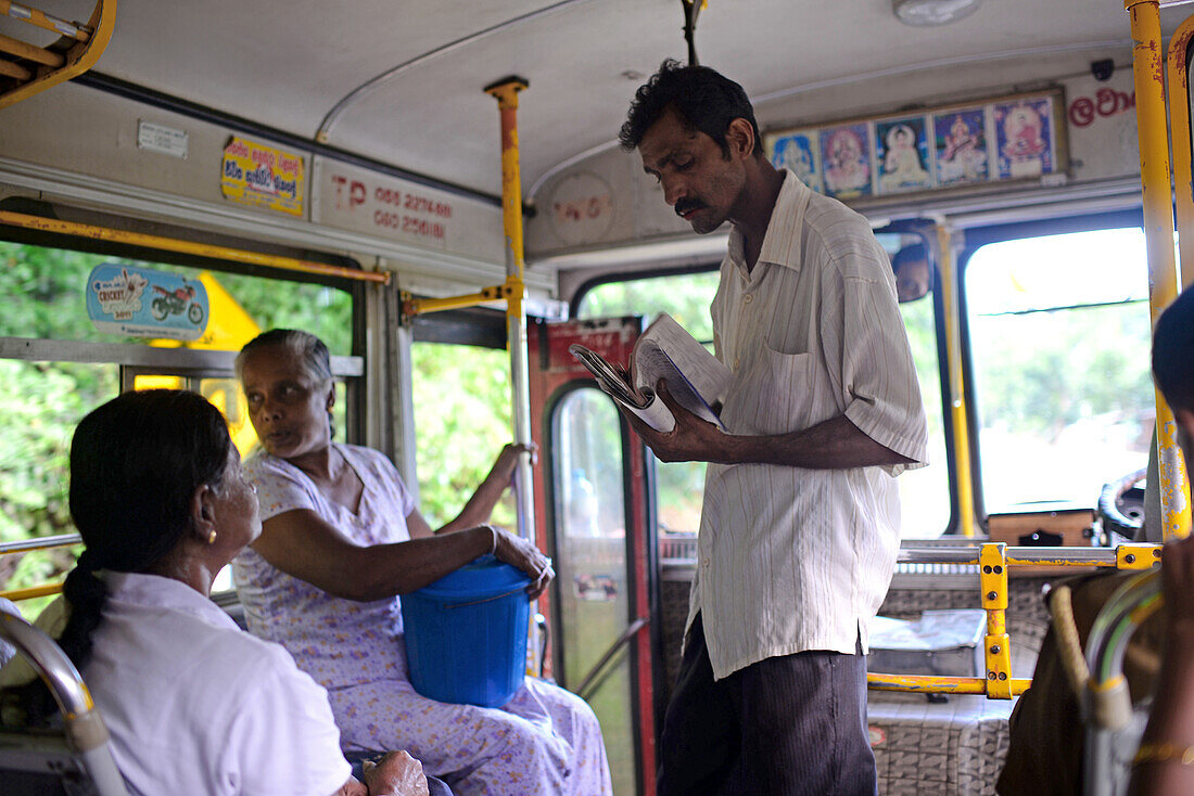Bus conductor in Nuwara Eliya, Sri Lanka